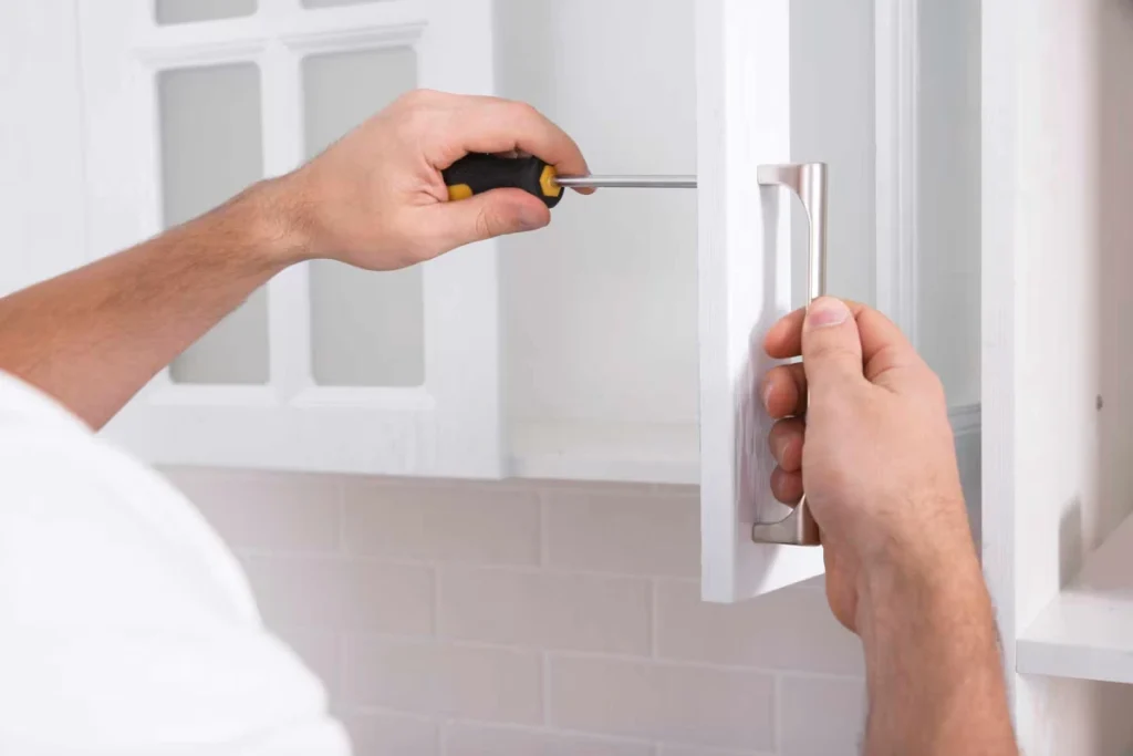 homeguide-handyman-installing-new-cabinet-hardware